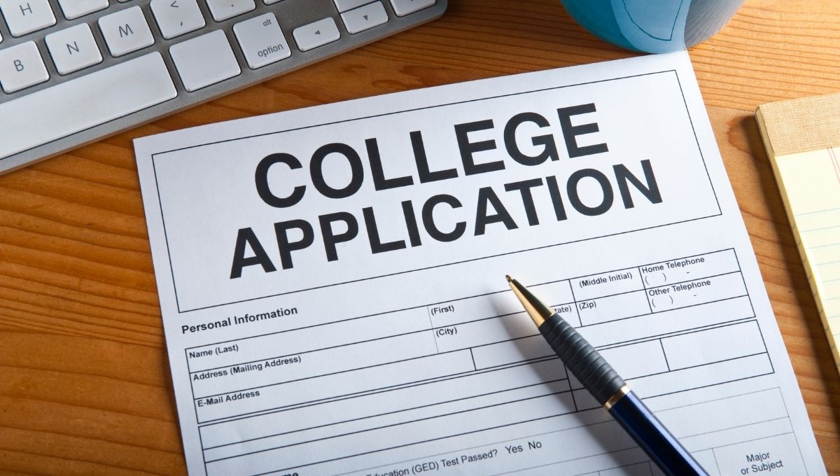 college application, on brown desk 