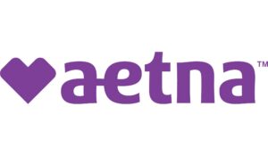 Aetna logo in purple, with a heart-shaped graphic to the left of the word “aetna” in lowercase letters.